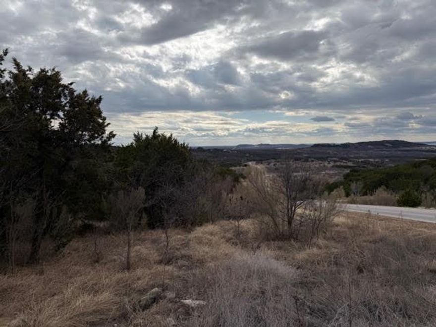 Five acres on the east side of The Hills that backs up to ranch land. This secluded parcel has a commanding view of the surrounding countryside including Possum Kingdom Lake. With five acres you may have livestock and extra outbuilding. The Hills is a very social community with lots of activities and great neighbors. No timeline to commence building. Lot ownership permits the use of all of the neighborhood amenities including; clubhouse with infinity pool and fitness center, boat storage area, community dock, boat ramp, lakeside recreation area with cabin including restrooms and covered patio, fishing pond, hiking trail, and twenty miles of private roads behind the gates.