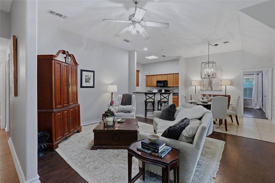 Light filled and inviting, this beautifully maintained home in the heart of Downtown McKinney offers soaring ceilings, rich hardwood floors, and an open layout designed for easy living.

The spacious living area is anchored by a stunning arched window that fills the home with natural light and flows seamlessly into the dining space and kitchen with ample counter space, bar seating, and storage.

The private primary suite features vaulted ceilings, abundant light, and an ensuite bath with dual vanities and a walk in closet. Secondary bedrooms offer flexibility for guests, office, or additional living space.

Enjoy a peaceful backyard with mature trees, providing shade and privacy for relaxing or entertaining.

Ideally located just minutes from Historic Downtown McKinney with convenient access to shopping, dining, and local events.

Move in ready with charm, comfort, and an unbeatable location.