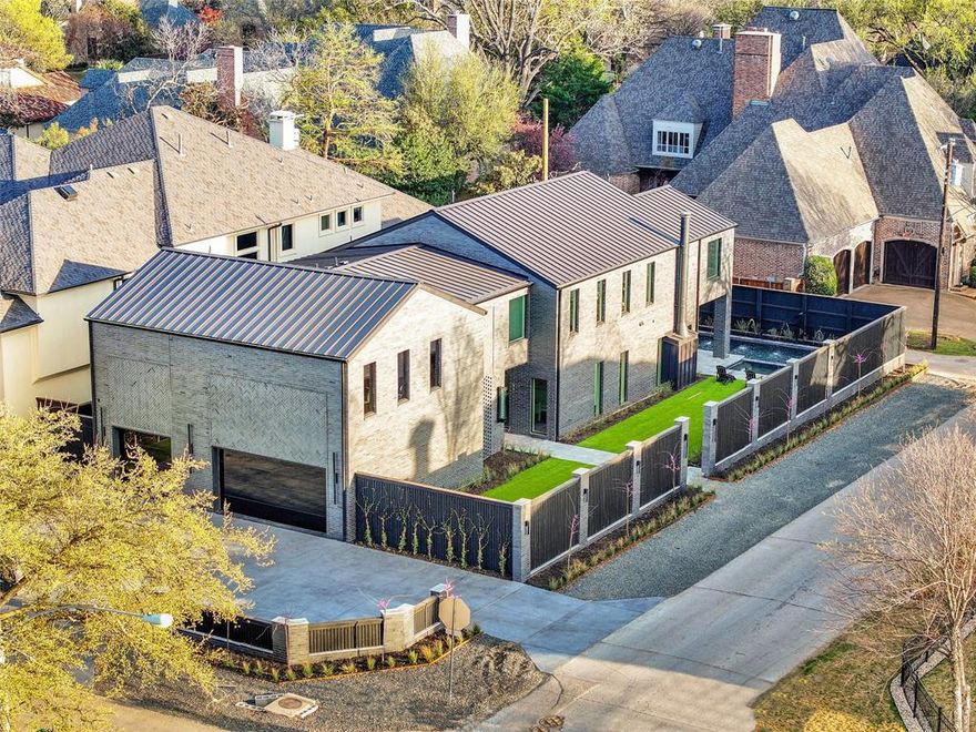 Stunning Custom home in the heart of Preston Hollow. This NYC-inspired home brings a chic and elevated design to Dallas. Exquisite exotic marble counters, backslashes, and fireplace. Oversized Primary steam shower. Modern wardrobe closet. Travertine outdoor walkways and pool decking. Built-in outdoor grille. Three-car garage with carbon epoxy floors and Sterling Black Glass doors. Custom Lighting and Lutron system. Custom built-in Refrigerators. Designer Pitt Cooking Cooktop. Modern Gloss black cabinetry throughout. The second floor features four bedrooms, a Wellness Room, a media room, a dual living room, and a storage room. A must-see for owners looking for a low-maintenance and private home. Creative Seller Financing Available!
