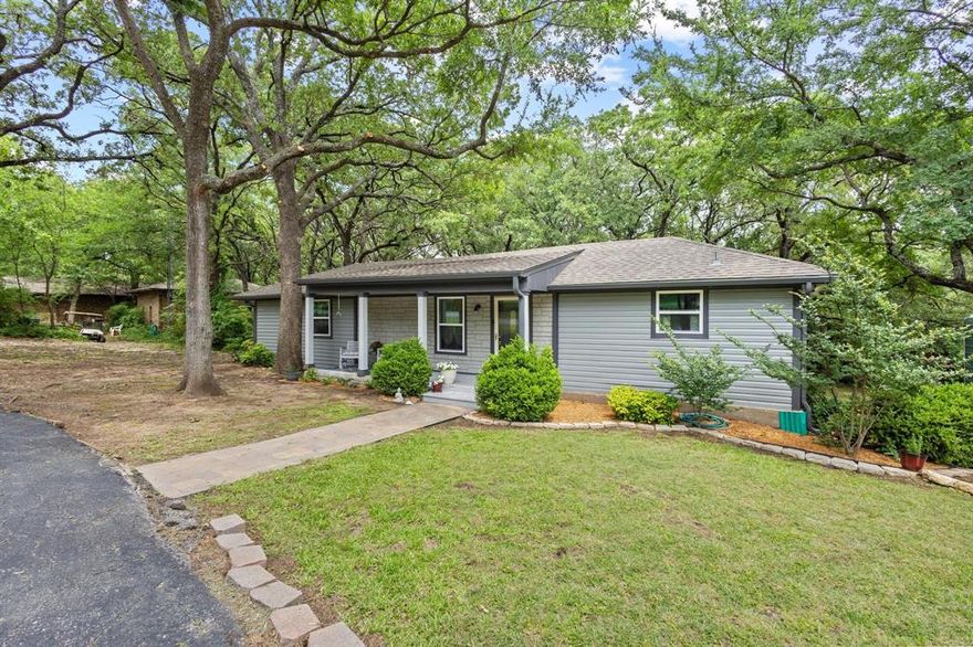 Lake Life Charm in Glen Ellen – Just Steps from Lake Texoma! Set beneath a canopy of mature trees and just across the street from sparkling Lake Texoma, 434 Crescent Drive offers the perfect blend of tranquility, space, and modern updates. This thoughtfully updated home welcomes you with a circle driveway and a 2-car carport, complete with a large shop—perfect for lake toys or storage, offering ample parking and functionality, which is rare for lake-area properties. Enjoy the peaceful vibe from the covered front porch, ideal for sipping coffee or enjoying sunsets. Step inside to a spacious living room with vaulted ceilings, a wall of windows, and built-in shelving, creating an inviting space filled with natural light. The split-bedroom layout provides great separation, with the primary suite, kitchen, and laundry on one side and two secondary bedrooms on the other. Recent Upgrades Include: Newer back deck perfect for relaxing or entertaining, Fresh interior paint & luxury vinyl flooring throughout, Stylish kitchen backsplash, new sink & faucet, plus updated appliances, New mirrors & lighting in both bathrooms, Complete exterior paint (May 2025), New gutters and downspouts, New aerobic septic system & water heater. Whether you're looking for a weekend escape or a full-time lake residence, this Glen Ellen gem is a rare opportunity. Don’t miss your chance to embrace lake life—schedule your private tour today!