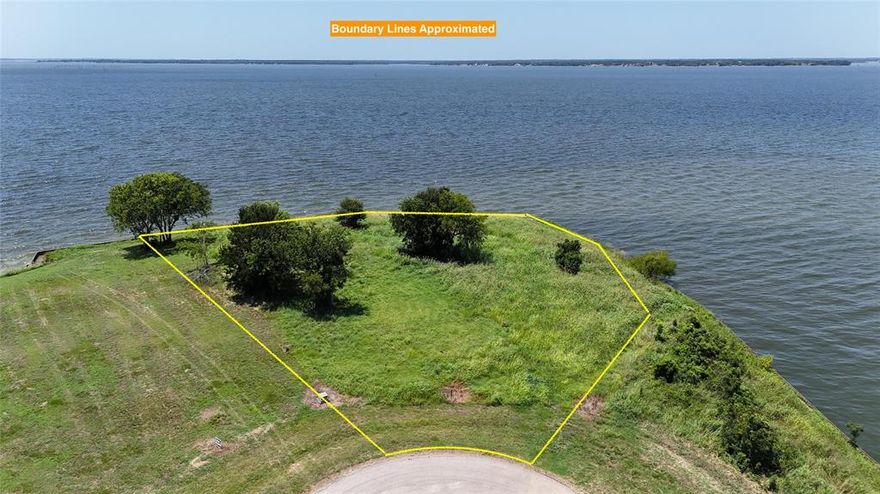 Tucked away at the end of a cul-de-sac in the gated community of Admiral Shores, this incredible 1.16-acre waterfront lot offers the kind of setting that is rare to find. Positioned on a peninsula, the property features an impressive 553 feet of dockable shoreline, wrapping around to deliver wide, open water views from nearly every angle. Whether you're dreaming of lazy mornings with coffee by the water, full days out on the boat, or evenings catching the sunset in total peace, this lot sets the stage for a life that feels like a permanent vacation. The lot is fully cleared and includes a sturdy steel retaining wall, which means you’re one step closer to breaking ground on that custom home you've always envisioned. There’s plenty of space to create something truly special here, whether it’s a sprawling lakeside retreat or a cozy full-time residence with panoramic views from every room. And thanks to the natural curve of the peninsula, you’ll enjoy a level of privacy that’s rare in any neighborhood, especially one with such easy access to deep, open water. Admiral Shores itself is a quiet, gated community that offers a sense of security and exclusivity while still being close enough to nearby conveniences when you need them. It’s the kind of place where neighbors wave from golf carts and starry nights are part of the regular routine. If you’ve been waiting for the perfect waterfront property that combines space, privacy, and unbeatable views, this lot truly checks all the boxes. Come see it for yourself—it just might be the beginning of your next chapter by the lake.