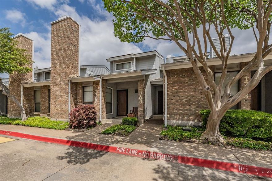 Beautifully updated condo perfect for first time home buyer or those ready to simplify your lifestyle.  This two bedroom, one bath condo offers easy, low maintenance living in North Dallas.  Enjoy this open living floorplan featuring vaulted ceilings, plenty of windows for natural lighting, vinyl wood flooring, and beautifully patterned ceramic tile in kitchen and bathroom.  The modern kitchen boasts stainless steel appliances, quartz countertops, and  soft close cabinets. In the living room, a wood burning fireplace is ideal for cozy evenings.  The dining room opens to a balcony ready for casual dining or relaxing evenings.  This unit features utility closet with space for full size washer & dryer.  It has it's own one car garage with added storage plus an assigned parking spot.  The HOA includes exterior maintenance, water, and trash.  Plan your summer cooling off in the community pool or after hiking or biking down the nearby Preston Ridge Trail.  FHA approved, this condo is conveniently located just south of George Bush Turnpike with easy access to Dallas North Tollway, University of Texas at Dallas, shopping, and restaurants.