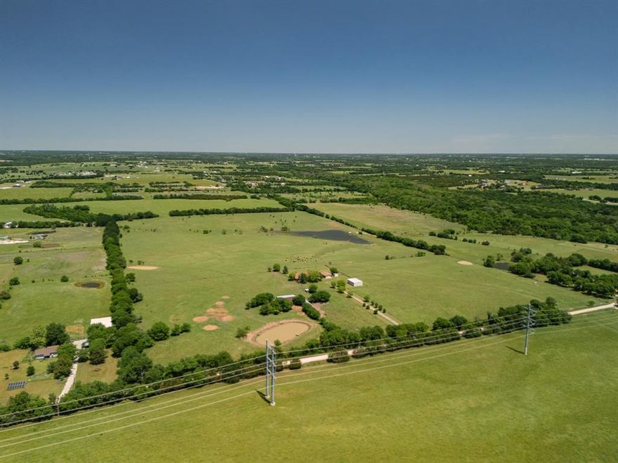 This 62.65-acre property located in Collin County with four ponds, open pasture, and a well-maintained residence, located between Blue Ridge and Farmersville along Highway 78. The land is AG exempt and features rolling terrain, fenced and cross-fenced sections, and a large stocked pond, creating a setting that supports livestock, recreation, or long-term land investment. The property includes a 3,004 square foot home with three bedrooms, two bathrooms, and a detached two-car garage, offering immediate usability while you plan future improvements or expansion. A 30x40 workshop with electricity and a concrete floor provides functional space for equipment, storage, or projects tied to the land. Utilities are in place with rural water, septic system, and co-op electric, and the property has county road frontage with access approximately 0.2 miles from Highway 78. The land is unzoned, allowing flexibility for agricultural use, residential living, or potential development opportunities. Pipeline easements are present. Positioned in a growth path of Collin County near the planned Outer Loop, the property offers a balance of open space and regional access, with Blue Ridge approximately 4 miles away, Farmersville approximately 6 miles away, and McKinney approximately 20 miles away. Opportunities with this combination of acreage, water features, and existing improvements are limited. Schedule a private tour to explore the property and its potential.