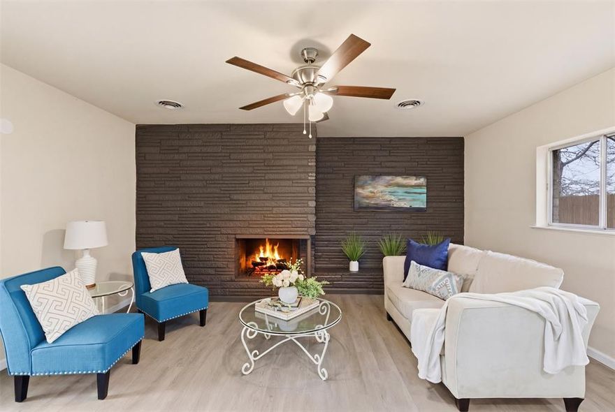 Fully renovated Hurst home with fireplace, courtyard, and unbeatable central location.

Beautifully renovated and perfectly located, this Hurst home offers the ideal blend of style and convenience. Enjoy quick access to major highways with an easy 20-minute drive to Fort Worth and about 25 minutes to Grapevine, Irving, or Arlington. Walk just one block to the Hurst Public Library and reach shopping, dining, and entertainment at North East Mall in about a mile.

Recent updates throughout the home include a new kitchen with granite countertops, two beautifully remodeled bathrooms, fresh interior paint, new luxury vinyl plank flooring, and a 1-year-old composition roof. The flexible floor plan offers 4 bedrooms and two spacious living areas.

The larger living area opens to the kitchen and dining space and showcases a striking painted stone feature wall with fireplace, creating a warm focal point for the home. New sliding doors lead to a covered porch and private courtyard with a new privacy fence, offering a peaceful outdoor space for relaxing or entertaining.

Situated on a corner lot with a side entry two-car garage, this move-in-ready home offers stylish updates and a location that makes getting anywhere in the Metroplex easy.
4 bedrooms • 2 living areas • granite kitchen • remodeled baths • painted stone fireplace wall • new sliding doors • covered porch & courtyard • corner lot • side-entry garage • recent updates throughout • 1-year composition roof.