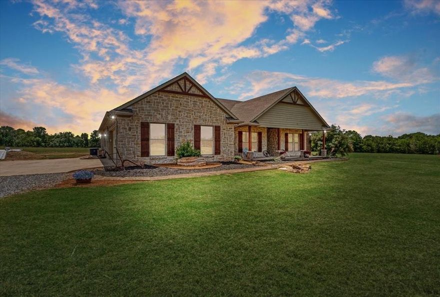 Welcome to the perfect blend of luxury and peaceful country living. Situated on 13.4 breathtaking acres, this custom-built estate offers the serenity of wide-open spaces paired with the comfort and quality of a thoughtfully designed home. Built in 2016, the home features soaring ceilings, expansive windows that capture stunning views of the surrounding countryside, and an open-concept layout ideal for everyday living and entertaining.

At the heart of the home is a spacious kitchen featuring granite countertops, stainless steel appliances, a large walk-in pantry, and both a breakfast nook and formal dining area, providing plenty of space for gatherings of any size. Foam insulation throughout enhances energy efficiency, while two attic access points—including one with walk-up stairs—offer convenient and abundant storage.

The home includes a private primary suite along with generously sized secondary bedrooms. Two of the secondary bedrooms feature en-suite bathrooms, providing additional comfort and privacy for family members or guests.

Outside, the property continues to impress with a 60x40 barn complete with electricity, water, two oversized roll-up doors, and a 15-foot overhang—perfect for equipment storage, projects, or entertaining. Additional features include a tankless water heater, whole-home generator, and an in-ground storm shelter for added peace of mind. Enjoy evenings gathered around the custom stone fire pit while taking in panoramic views of the rolling Texas landscape.

With two HVAC systems ensuring year-round comfort, this property offers the perfect opportunity for those seeking a private country retreat, hobby ranch, or spacious homestead while still enjoying modern amenities.