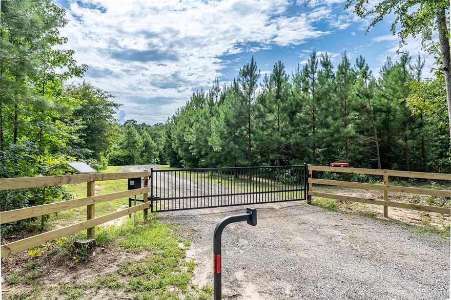 Peaceful retreat near Lake Hawkins! Custom home nestled on over 4.4 serene, wooded acres. This custom built home offers the perfect balance of privacy, charm, and modern comfort. With 3 spacious bedrooms and 2 full baths. Feels like your very own treehouse. Would be great as a weekend getaway or a full time residence. Inside, the open concept layout seamlessly connects the kitchen, dining, and living areas, creating a welcoming space perfect for everyday living or entertaining guests. Large windows throughout provide the interior with natural light and offer stunning views of the surrounding woods and wildlife. Step outside onto the expansive wrap around porch, the perfect spot for morning coffee, evening relaxation, or simply soaking in the peaceful sounds of nature. Whether you're hosting family and friends or enjoying a quiet evening under the stars, this outdoor space is a true extension of the home. Built just a few years ago, this home combines modern design with rustic charm and sits in a quiet area known for its excellent schools. Whether you're raising a family, retiring, or simply looking to reconnect with nature, this one-of-a-kind property is a must-see. Don't miss this rare opportunity to own a slice of East Texas paradise! Call today!