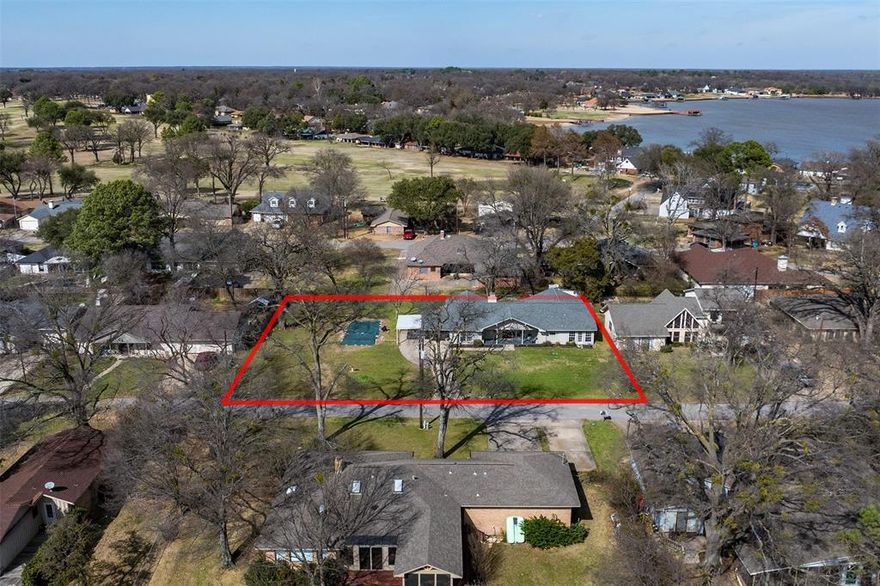 Nestled in a serene golf course community surrounded by a picturesque lake, this lovingly maintained three-bedroom, two-bath home offers comfort, privacy, and an exceptional lifestyle. Residents enjoy access to an 18-hole golf course and clubhouse, creating a true resort-style setting.
Situated on a generous and rare .48-acre lot, the home features a courtyard that serves as a peaceful outdoor retreat—perfect for relaxing or entertaining. Inside, the inviting living area is centered around a wood-burning fireplace, currently outfitted with propane logs, adding warmth and charm. Additional highlights include a second living area, a one-car attached garage, two covered carports, and spacious grounds that provide both openness and tranquility. Thoughtfully cared for and full of character, this home reflects pride of ownership throughout. Whether you’re seeking a full-time residence or a weekend escape, this property offers the perfect blend of comfort, space, and scenic golf-course living.