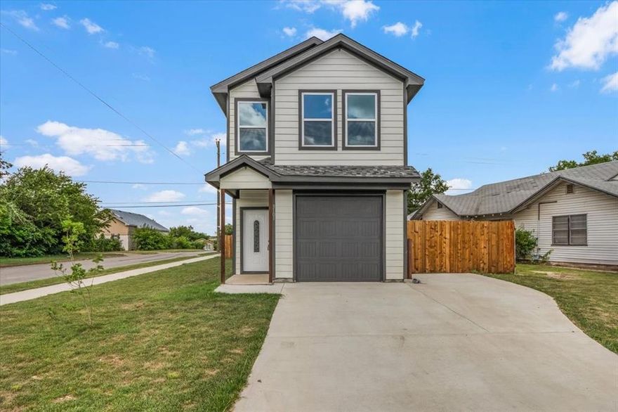 Welcome to this breathtaking new home in the heart of Fort Worth! Perfectly situated with easy access to I-35 and I-820, you're just minutes from the iconic Stockyards and the vibrant downtown area. Step inside to discover a bright, open-concept floor plan filled with natural light. The modern kitchen features white cabinetry, a spacious island, and plenty of room for cooking and entertaining. The home includes an upstairs level and is filled with windows throughout, creating a warm and inviting atmosphere. Located on a generous corner lot, this home offers abundant outdoor space and a large backyard—ideal for gatherings, gardening, or relaxing in the Texas sunshine. Don’t miss your chance to own this stunning new construction!