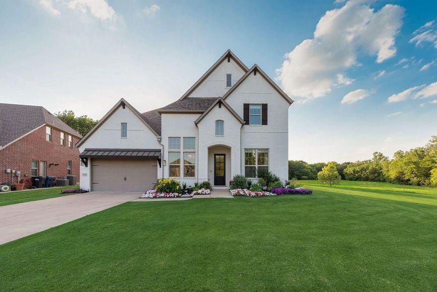 Experience sunset & lush views in this gorgeous MI Home in Heatherwood Estates in Prosper ISD! With the privacy & serenity of country living, but with the conveniences of the city, this amazing home offers 5 oversized bedrms + office, bonus rm, 5 bathrms, game rm & media rm. Pull up to a private wooded cul-de-sac & extended driveway for timeless & charming curb appeal with white brick elevation, manicured flower beds, golf course like grass, mature trees and green pastures! With so many tasteful & elegant design choices throughout, this home truly feels inviting, elevated, intentional & personal. Upon entry, you will find vaulted ceilings in the foyer with a grand staircase & balcony, the perfect work from home office with custom trim and a stunning formal dining featuring treelined views, mirroring the amazing accent wall. Owners recently had entire home painted, trim, installed new carpet, light fixtures, countertops & fresh landscaping!! Boasting upgraded & resilient white oak hardwood flooring throughout the living areas, the living room features a stately gas log fireplace and built-ins with ample natural light & large windows with storage throughout. Gourmet chef's kitchen has gas cooktop, stainless steel appliances, quartz counters, apron sink, floating shelves, oversized island & large pantry! Primary suite has bay window and sitting area, with the bathroom offering double vanities, walk in shower with two entrances, & tub. Downstairs, includes 2 bedrooms, office & bonus room for a great gym space and upstairs features 3 bedrooms, a large game room with storage + built in bunkbed, & a full size media room with projector, speakers, & screen included! This dreamy backyard has extended concrete & pavers, gas line for grilling, storage shed, wrought iron fence & scenic views! Situated in an excellent location of McKinney, it is walking distance to community & city parks, trails, pool, playgrounds, schools, & retail! Don't let this one go, it's too good & rare!
