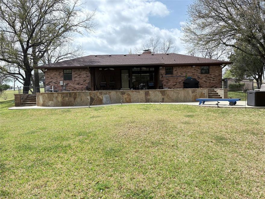 Discover this stunning 3-bedroom, 2-bath home featuring a spacious open floor plan and an inviting pool. Located along a beautiful Bosque  riverfront, the property offers direct access via concrete steps—ideal for fishing and kayaking enthusiasts. Surrounded by mature pecan, pear, and pomegranate trees, along with native mustang grapes, it creates a vibrant, natural setting that attracts deer and local wildlife. Nights here are truly special, with breathtaking starry skies.
