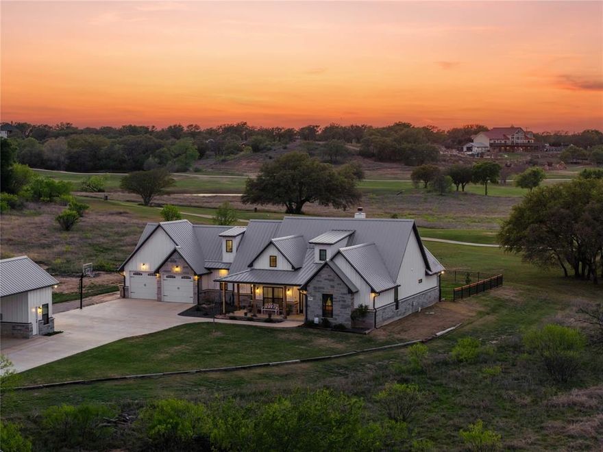 Imagine relaxing on your back patio, sipping your favorite drink as the Texas sunset paints a breathtaking backdrop over the rolling fairways of a pristine golf course. This is the lifestyle that awaits at this exceptional property—perfectly positioned on the third tee box at the prestigious Hideout Golf Club and Resort.Beyond the stunning views, the community delivers it all: direct access to the championship golf course, resort-style pool, on-site restaurant and bar, pickleball courts, tennis courts, and fully equipped workout facilities.This meticulously crafted dream home leaves no detail behind. Step inside to soaring vaulted ceilings and a striking rock fireplace that anchor the expansive open floor plan, centered around a large kitchen island ideal for effortless entertaining and family gatherings. The gourmet kitchen is a chef’s paradise, complete with a commercial-grade refrigerator, elegant decorative lighting, and a dedicated ice machine ready for large crowds.Upstairs, a versatile flex room easily transforms into a game room or kids’ play space. Need a fourth bedroom? The spacious office can be converted—or it can serve beautifully as a formal dining area.Mornings feel magical in the primary suite, where panoramic golf course views greet you from the moment you wake. The luxurious ensuite bath features an oversized walk-in shower, dual sinks, and a custom closet system designed for effortless organization.Thoughtful upgrades set this home apart: a durable metal roof, energy-efficient spray foam insulation, whole-home water softener, underground sprinkler system, RV or boat carport, dedicated golf cart garage, private basketball court, and an oversized garage for all your toys.This isn’t just a house—it’s your forever retreat at Hideout Golf Club and Resort.