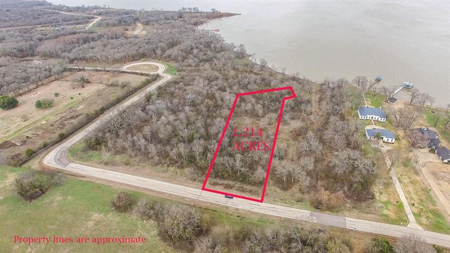 Bring your building plans for this desirable lot in the Edgewater Addition of Cedar Creek Lake.  Including 1.214 acres with gorgeous mature shade trees, this lot also boasts 30 ft of dockable frontage.  Edgewater at Cedar Creek is a gated community of 148 luxury lots located about 45 minutes southeast of DFW.  Amenities include 10 acre lakefront pavilion, community boat slips, and a park. This is an unbelievable opportunity to purchase a waterfront lot, priced at $50k less than the tax office appraised value.  Don't miss your chance to make this property your own!