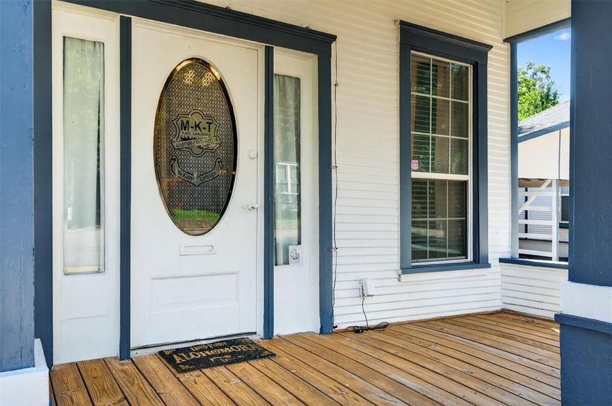 Built in 1920, this home is full of character and makes great use of space, all less than a mile from Downtown Denison with its shopping, dining, live music, art walks, and festivals just minutes away. Located in a quiet neighborhood, the property features tall ceilings and a welcoming covered front porch. The spacious living room is filled with natural light, and a versatile flex space is ideal for an office, game room, or formal dining area. The primary bedroom is generously sized with tall ceilings, and the full bath is highlighted by a classic clawfoot tub with shower. The eat-in kitchen, accented with tin ceiling tiles, includes the refrigerator and the washer and dryer. A 5’ x 6’ alcove off the kitchen and utility room functions as a large pantry and extra shelving space, while an 8’ x 6’ mud room provides direct access to the carport. Outside, the shared driveway leads to a carport with additional storage space. The property is currently tenant occupied. The property has a shared driveway and carport with 1231 W Main, also for sale. Together, the two homes are perfect for multi-generational living, a mother-in-law suite, or investment opportunities.