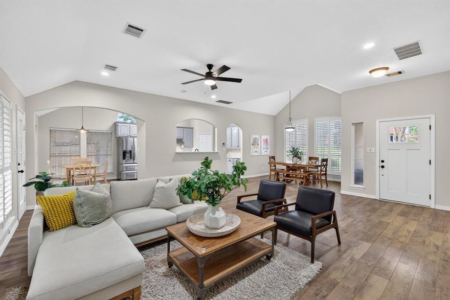 UPDATED gem, tucked into an established neighborhood on an oversized lot, shaded by a beautiful canopy of mature trees. This 3 bed, 2.5 bath home blends timeless character with modern comfort across a unique & open 3-story floorplan. Warm wood floors span the main & lower living areas, while a soft, neutral palette & charming shiplap accents create an inviting feel thru-out. The main level offers an open, light-filled layout where walls of windows frame a serene backyard view. The living room features a built-in electric fireplace & easy access to the patio which sets the stage for your design ideas; an ideal canvas to craft a truly exceptional outdoor living retreat. The stylish, functional kitchen opens to the living spaces & features quartz counters, a 5-burner gas cooktop with vent, SS farm sink, walk-in pantry, & a convenient pass-through breakfast bar to the living & dining area. A well-designed laundry room with folding space, drip-dry area, built-in cabinetry, & a nearby half bath add everyday ease. Just a few steps upstairs, the spacious primary suite includes a generous walk-in closet & a beautifully updated ensuite bath with freestanding soaking tub, separate shower, & custom built-ins. Two secondary bedrooms each offer walk-in closets & built-in desks. A full bath with generous built-ins, plus additional hallway closets & access to a decked walk-in attic, ensure there’s no shortage of storage space! The lower level expands your living options with a private office featuring a multitude of built-ins + 2 closets, along with a large game room, currently in use as a home gym, that overlooks the backyard.  The garage opens to this level & includes built-in cabinets & closets. Outdoors, enjoy a newly sodded, oversized backyard beneath mature trees—an ideal setting for entertaining or quiet evenings. Located just blocks from the Colleyville Rec Center with convenient access to SH 121 & Hwy 114, this MOVE IN READY home offers both tranquility & accessibility!