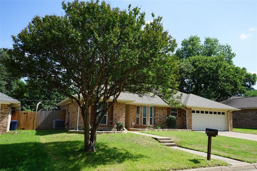 Freshly Updated & Move-In Ready on a Quiet Court!
This beautifully refreshed 3-bedroom, 2-bath home with a 2-car garage offers comfort, style, and an ideal layout. Fresh paint and thoughtful updates make this home truly move-in ready. The inviting living room features a cozy brick, wood-burning fireplace, perfect for relaxing evenings. The kitchen includes stainless steel appliances—with the refrigerator included—and a window over the sink that brings in natural light and a pleasant view. The dining area is filled with windows, creating a bright and cheerful space for everyday meals or entertaining. The split-bedroom floor plan provides privacy, with the primary suite tucked away from the secondary bedrooms. The spacious primary bath offers dual sinks, two closets, a garden tub, and a separate shower with a new frameless glass door. Step outside to a large, fenced backyard with plenty of green space and an 8-foot rear fence for added privacy. An extra-large 11 x 8 shed provides ample storage for tools, hobbies, or equipment. Located in highly sought-after AISD schools and near the University of Texas Arlington (UTA) Only a few minutes to Lake Arlington, where you can enjoy boating, fishing, trails, and scenic views. You’re also only about 10 minutes from the Arlington Entertainment District—home to the Texas Rangers, Dallas Cowboys, and the National Medal of Honor Museum—offering world-class sports, entertainment, and culture.