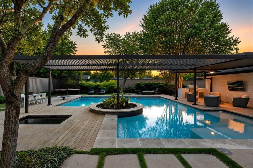 Modern Luxury. Private Retreat. Unforgettable Living. Revel in elevated living in this stunning single-story modern masterpiece, exquisitely remodeled in 2022 & nestled on a beautifully landscaped .493-acre lot in one of the area’s most prestigious neighborhoods—just moments from scenic walking & jogging paths. From the moment you arrive, the circle drive sets the tone for the sophistication that await inside. This 4-bedroom, 4-bath residence seamlessly blends sleek contemporary design with everyday functionality. Expansive living spaces invite both grand entertaining & intimate moments with elegant formal living with fireplaces & wet bar, spacious vaulted media room with direct access to the backyard oasis! Light-filled great room with built-ins & a gas fireplace that has an open-concept flow connecting kitchen & dining areas. This is a kitchen that Inspires! At the heart of the home, the chef’s kitchen is a true showpiece, featuring: Cantoni Silestone counters, top-of-the-line appliances, double ovens, warming drawer, Miele espresso bar, exceptional craftsmanship & thoughtful design, perfect for hosting, gathering, & creating memorable moments. It truly has a private sanctuary! The luxurious primary suite is your personal escape, complete with custom closets & a beautifully updated spa-like bath. Just beyond, step into your private Zen garden—a serene outdoor retreat with a relaxation fountain & sitting area, designed to bring peace & tranquility to your daily routine. Enjoy the resort-style backyard paradise. It is simply extraordinary—crafted for year-round unforgettable entertaining with its sparkling diving pool & spa, cooling water misters for warm Texas days, lush turf for low-maintenance beauty, inviting gas firepit for evening gatherings, fully equipped outdoor BBQ & living area, rear gate access with dual basketball hoops, added privacy & an additional storage shed for convenience. Every detail has been curated to create a true private resort experience.