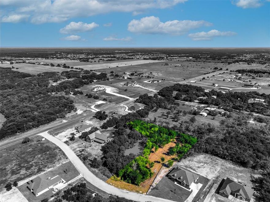 Nestled within the serene Vista Oaks Estates in Royse City, Texas, this expansive 1.942-acre parcel offers an unparalleled opportunity to build your dream home. Adjacent to a pond, the land provides a tranquil setting, perfect for creating a private oasis. The property boasts ample space for a custom-designed residence, complemented by the natural beauty of its surroundings. With its prime location in a sought-after community, this lot combines the allure of rural charm with the convenience of nearby amenities. Royse City offers excellent schools, charming local shops and downtown events, and a variety of dining options, ensuring all your needs are met. Embrace the chance to craft your ideal lifestyle in this idyllic setting, where every day brings peace and serenity with the convenience of modern amenities.
