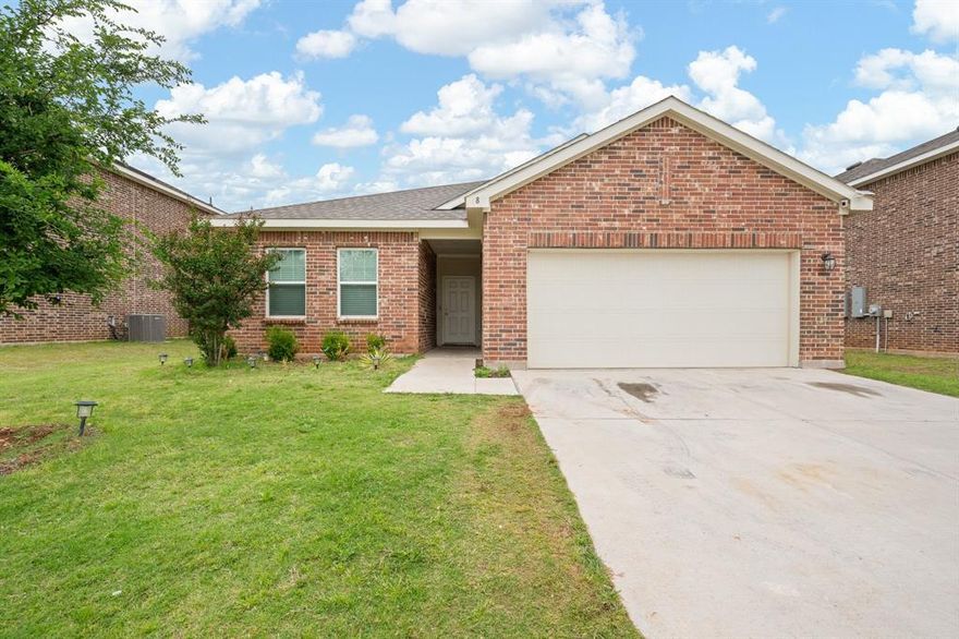 Here is the updated description for 8 Glen Crossings Ln:

---

Welcome home to this beautifully maintained 4-bedroom, 2-bathroom home built in 2022, offering modern finishes and an open-concept layout designed for today's lifestyle. From the moment you arrive, the charming brick exterior, two-car garage, and manicured lawn set the tone for what awaits inside.

The heart of the home is a chef-ready kitchen featuring white shaker cabinetry, stainless steel appliances, granite countertops, and an oversized island with bar seating — perfect for entertaining or everyday family life. The kitchen flows seamlessly into the bright dining area and spacious living room, creating an effortless open-concept experience filled with natural light.

Four generously sized bedrooms offer flexible space for family, guests, a home office, or whatever fits your needs. Both bathrooms are tastefully appointed with dual-sink vanities and quality finishes throughout.

Step outside to a generous backyard with a lush lawn and plenty of room to enjoy Texas outdoor living. A bonus storage shed adds practical value. Built in 2022, this home still feels brand new and is truly move-in ready.