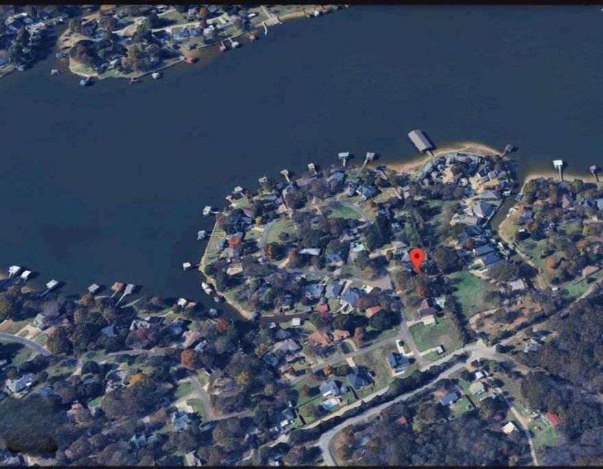 Located in a well established, gated lake community, this lot offers the perfect opportunity to create your ideal getaway or full-time residence. Nestled among mature trees and surrounded by nature, the property provides a peaceful setting just moments from the water. Residents enjoy exclusive access to community amenities such as a gated entry, private boat ramp and pier and well-maintained. Whether you're looking to build now or invest in the future, this lot offers the perfect blend of seclusion, security, and lake lifestyle. Utilities are available at the street. Don't miss your chance to own a piece of lake paradise!