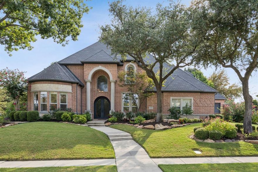 Recently Refreshed & Back on the Market due to buyer financing. Stunning East Facing Gem in McKinney, TX voted Best Place to Live in the U.S! Experience refined living in this custom masterpiece, gracefully situated on a large corner lot embraced by sweeping greenbelt views & tranquil ponds. Walls of windows frame a picture of serenity, while the setting offers both privacy & the vibrant active lifestyle of Stonebridge Ranch—with highly rated Bennett Elementary just a short walk away. From the moment you arrive, stunning iron doors welcome you into a grand entryway where soaring ceilings lead to an open concept kitchen & family room to create the stage for effortless entertaining. The chef’s kitchen is a showpiece, blending rich honey maple cabinetry with sleek granite countertops & premium appliances that will inspire culinary creations. The main level has updated paint & lighting, & is a sanctuary of comfort & elegance. Retreat to the expansive primary suite, host guests in their own private suite, or work in style from the distinguished office with coffered ceilings. A versatile lower level flex room with breathtaking pond views invites possibilities—from a game room to an intimate lounge. Hardwoods flow seamlessly throughout, adding warmth & timeless sophistication. Upstairs, the luxury continues with a spacious game or play area & three oversized bedrooms—each with hardwood floors, walk-in closets & bath access, ensuring comfort for all. Step outside to your own resort-style paradise. Multiple patios frame the sparkling pool & spa, where majestic trees & shimmering water create a backdrop of pure tranquility. It’s the perfect setting to savor Texas sunsets & make lasting memories. A rare combination of elegance & function, this residence also offers generous storage, expansive pantries & a side facing, three-car gated garage courtyard. With a subzero fridge, washer, dryer, TVs, state of the art audio system & pool table included it's ready to move right in!