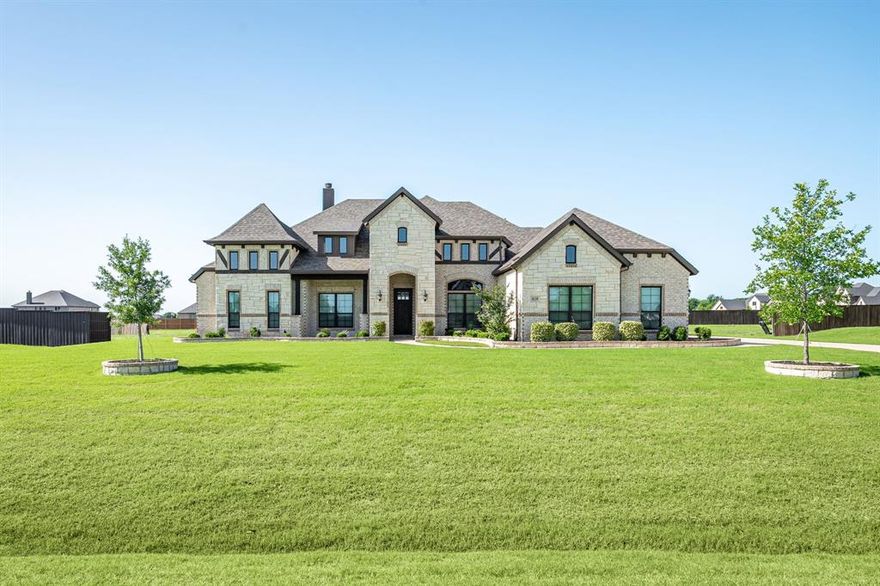 **STUNNING AND ELEGANT CUSTOM-BUILT HOME** **SOUGHT-AFTER LEGACY ESTATES** **BETTER THAN NEW CONSTRUCTION ON 1 ACRE - WHY WAIT** **NOT A DRIVE-BY** Gorgeous first impression driving up and seeing the stone & brick elevation. Ample covered front porch.  One of the larger homes with just over 3,700 sq. ft.  The perfect floorplan with everything a modern home needs.   Plus, most of the home is a single-story home with all the bedrooms downstairs and only the media room & half bath upstairs. Immaculately maintained with soaring ceilings and many modern upgrades throughout including wood flooring.  Awesome gourmet kitchen with extended high-level granite island, glass front upper cabinetry great for display and function with in-cabinet lighting, 36” inch gas cooktop and more!  Adjacent dining room. Eye-catching centered-beam cathedral ceiling in living room with floor to ceiling stone fireplace and two built-in lower cabinets with upper shelving. There is a desirable large flex space (currently a gym) with access to the covered back porch.  Huge owner's retreat with beautiful ensuite featuring dual vanities with luxurious soaking tub and walk-in shower - custom closet with two built-in chests and a secondary entrance-exit!   Private office at the front of the house with French doors.  Jack & Jill styled bathroom with WICs.  Additional bedroom with bathroom close-by (possible multigenerational set up with flex room nearby) Huge side entry 3-car garage.  This is a must-see home, no need to wait to build, this is done and ready for move in.