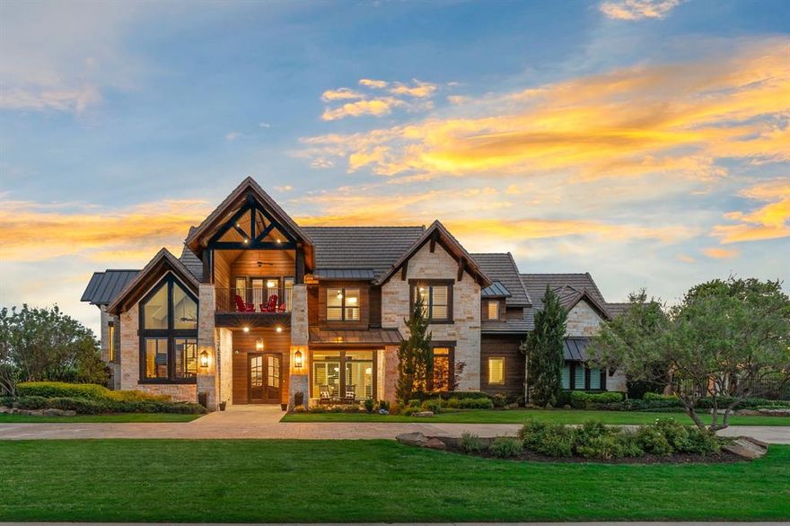 This architect designed custom home was recently updated. It offers high ceilings and picturesque windows that let in beautiful natural light. The main staircase has multiple levels, including a mezzanine office and sitting area that are truly unique. The second staircase is convenient to the spacious, eat-in, chef’s kitchen which has two massive islands, flex space, and professional grade appliances along with a large walk-in pantry. The wet bar butler’s pantry is conveniently positioned to serve any gathering. The primary suite on the main floor has a sitting area, fireplace, spa-like ensuite and an impressive closet which includes a private laundry. A second bedroom with ensuite on the main level is convenient, yet private. Upstairs has 2 bedrooms with ensuites, a sitting area, game room and theatre room.  A future elevator is framed and prewired. The home sits on a very private 2+ acre estate in the desirable, guarded, French country, neighborhood Chateau de lac. Absolute must see!