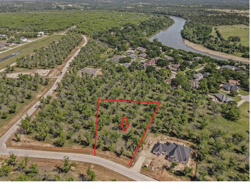 Large (1.589 A) lot in The Landings East at Pecan Plantation, offering many mature Pecan trees, privacy and elbow room to build your dream home.  This is a deep lot, which measures 131 x 358 x 275 x 295. Development is complete with concrete roads, electric service, MUD water & sewer. Homeowners can also take advantage of Orchard irrigation; high speed internet is available. 2,000 SF minimum in this section of Pecan. Owner may use builder of choice. Mandatory HOA membership. Current PPOA Membership fee is $5,545.65, to be paid by Buyer at closing. The monthly fee for a vacant lot is $182.75. Once a home occupies the lot, monthly assessment will be $204, to include weekly trash pick up.