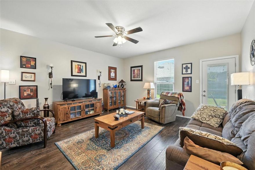 Charming 3-bedroom, 2-bath home with 1,327 sq ft of living space. This home offers an open-concept layout with a kitchen that flows seamlessly into the living area. The kitchen features stainless steel appliances and ample storage space. Vinyl plank flooring runs through the main areas, with carpet in the bedrooms for added comfort.

Step outside to enjoy the extended patio with a pergola, ideal for relaxing or hosting gatherings. Conveniently located near Boswell High School and just minutes from Eagle Mountain Lake.