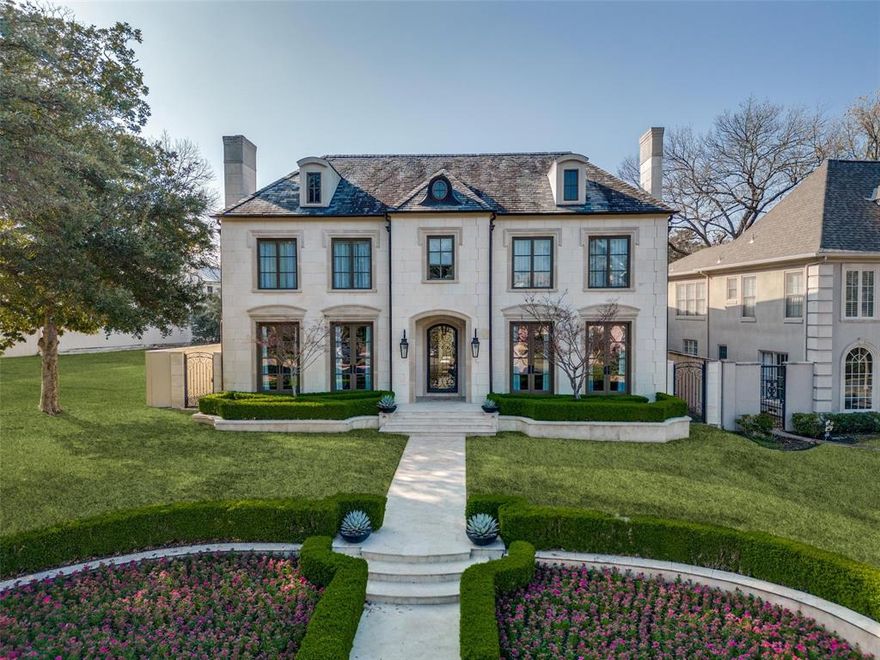 A French Provincial like no other, this home spans an 80-foot frontage in original Highland Park. Hand-cut limestone wraps the exterior accented by copper gutters, dormer windows and slate roof. Interiors feature dentil crown moulding, fine artisanal craftsmanship, and a layout that compliments every family size and generation, all with a soft contemporary style. The first and second floors of the residence consist of 7512sf with five bedrooms-all with private ensuites and walk-in closets. One guest room is located on the first floor while primary is up featuring a wet bar, his and her closets, and ensuite adorned with mosaic marble tile. The elevator provides access to all three floors including the 1310sf basement with flex space, media room and wine room. Located over the three-car garage is the 458sf guest quarters-a sixth bedroom with kitchenette and private access. Enjoy this well-maintained single-owner home with ease of access to parks, neighborhood amenities and fine dining.