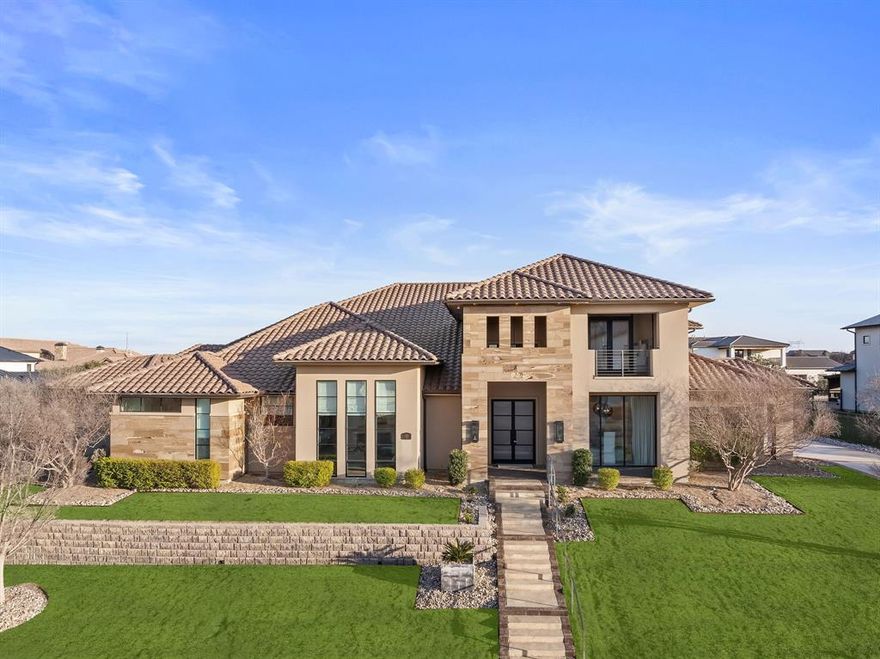 An opulent estate nestled in the prestigious guarded-gated Hills of Kingswood enclave. This exquisite residence spans 6,880 square feet and is set on a sprawling 0.773-acre lot, offering a harmonious blend of luxury and comfort. The home's striking stucco-stone façade and elegant tile roof create an unforgettable first impression. Inside, the grandeur continues with five spacious bedrooms and six luxurious bathrooms. The architectural brilliance is evident in every detail, from the expansive floor-to-ceiling windows to the accordion-style doors that seamlessly merge indoor and outdoor living spaces. The estate's design caters to both lavish entertaining and serene relaxation. The expansive open floor plan boasts a large gourmet style kitchen with an expansive island, custom cabinetry and stainless-steel appliances, which includes a gas cook top. A spacious formal dining room, a robust study with built-ins, and first-floor media room with a serving bar and a six screen tv panel that allows access to view several channels all at one time. Perfect for any sports enthusiast. A dedicated wine room and a 2nd floor game room add to the home's entertainment appeal, while a mother-in-law suite ensures privacy and comfort for guests. Step outside to discover your private oasis—a stunning swimming pool with water features, surrounded by a well-appointed outdoor living center and kitchen. This tranquil space is perfect for enjoying Texas sunsets and al fresco dining. Experience the epitome of elegance and luxury at this remarkable estate.