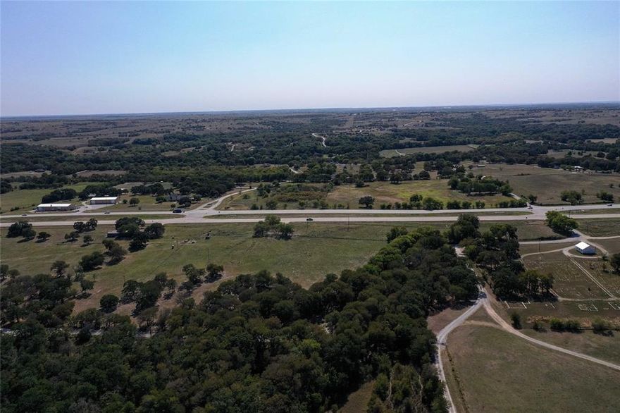 Attention, investors, developers, and commercial business owners!  Large amount of highway frontage on major, busy highway!  Located just 5 miles from downtown Decatur and situated on Hwy 380 inside the Decatur school district makes this property a developer's dream! Approximately 2,448 feet of US-380 Hwy frontage is ideal for potential commercial use as well.  County Road 2315 creates the west and north boundary of this property while 380 creates the southern boundary of the property.  The west boundary of the property is located at a US-380 Hwy crossover, and the west boundary is near another US-380 Hwy crossover.  The perimeter of the 50+- acres is completely fenced.  Bring your business to Decatur, develop a residential area of lovely houses, or use the acreage to build your dream home!  Come and enjoy the highly sought after Decatur area in gorgeous Wise county!  Owner is willing to sell less than 50 and up to 60+ acres of this tract of land.