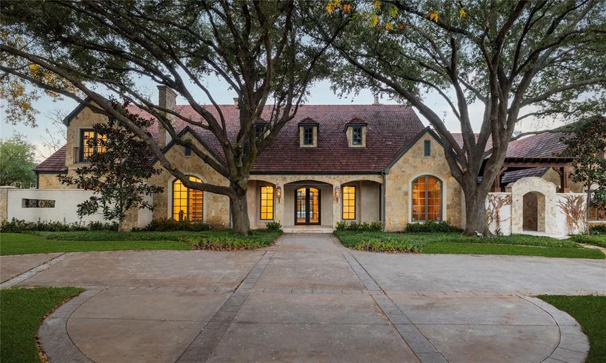 Discover refined living in this meticulously remodeled estate on 1.26 acres in the prestigious estate area of Preston Hollow. This fully gated property offers luxurious living with multiple living spaces, 5 bedrooms & 6.2 bathrooms. The primary suite features his & her baths, an enclosed walk-through shower with a soaking tub, a two-story primary closet, & its own private courtyard with a spa. Entertain in style with a central focus on the stunning pool & spa, creating an enchanting outdoor oasis. Indoors, elegance abounds with a handsome study featuring cathedral ceilings, a FP, & built-in bookcases. A stunning parlor with wet bar, FP, & climate-controlled wine storage adds to the sophisticated ambiance. The separate two-story guest quarters feature 3 bedrooms, 3 full baths, 4 fireplaces, & a full kitchen with top-of-the-line appliances. Nestled among mature trees, this property provides a private and serene escape, marrying luxury with tranquility.