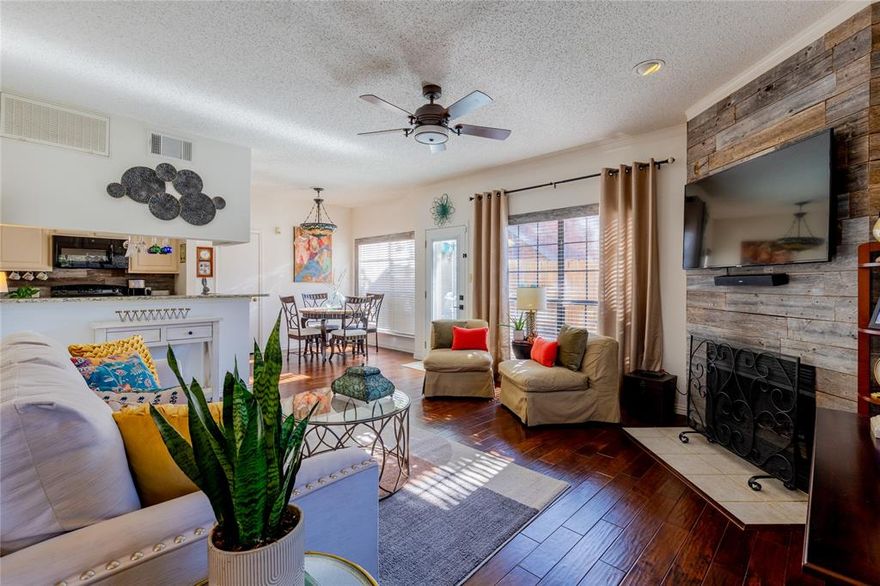 Incredible opportunity to invest in this beautiful Dallas condo featuring 2 bedrooms and 1.5 bathrooms. This light and bright end unit is move-in ready and offers a lock-and-leave lifestyle. The open floor plan flows easily for modern living, with a dining area door leading to your private patio for all-day and nighttime enjoyment. Enjoy the wood-burning fireplace and sleek dark hardwood floors. The heart of the home lies in the kitchen, featuring stunning granite countertops that offer an inviting breakfast bar seating option. Additionally, the abundance of windows and ample storage spaces contribute to the overall comfort and appeal of the home. The spacious primary bedroom features a large walk-in closet, while the secondary bedroom accommodates a comfortable sitting area, ideal for a home office. The upper level bathroom is equipped with dual sinks and ceramic tile and is accessible to both bedrooms. The attached one-car garage provides additional storage space with shelves and hookups for a full-sized washer and dryer. The homeowners’ association (HOA) dues cover expenses for water, sewer, and trash, and residents enjoy full access to the community pool and worry-free grounds maintenance. Conveniently situated near the LBJ Freeway and the tollway.