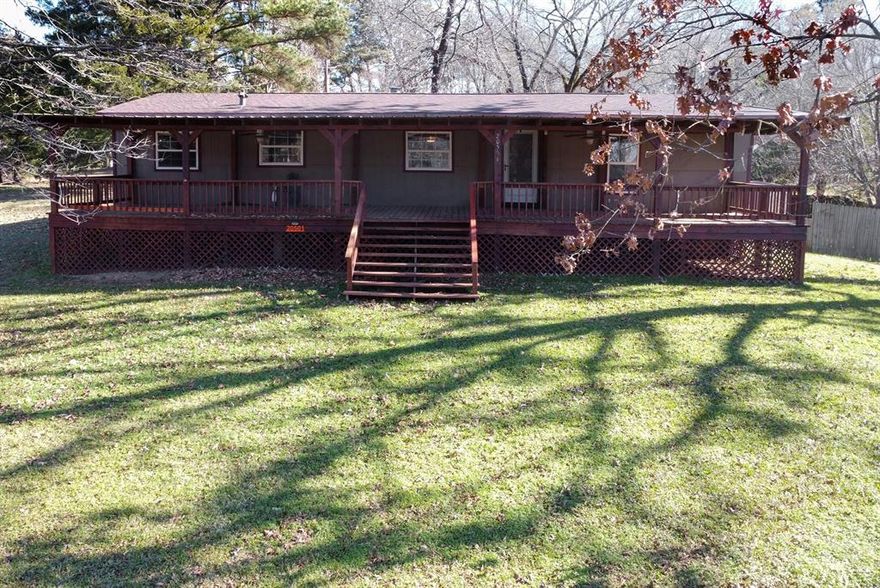 Well-maintained East Texas home situated on approximately 1.8 acres with scenic views of Lake Palestine. This spacious 3-bedroom, 2-bath residence offers an open-concept living area featuring a wood-burning stove, ideal for cooler evenings. Theliving room flows seamlessly into the updated kitchen, which includes a large island and pantry. Recent improvementsinclude updated flooring, replacement windows, and a new roof installed in 2025. The primary bedroom is split from the guestbedrooms and features an ensuite bath with a garden tub and separate shower. A generous utility room provides space foran additional freezer or storage. Flooring has been updated in the kitchen, hallway, and guest bedrooms. The home wasprofessionally leveled in 2024. An additional surveyed half-acre offers potential for future development or resale, subject tobuyer verification; septic approval is already in place. Exterior features include a large concrete driveway, three coveredcarports, and a shopstorage building. Enjoy lake views from the spacious front porch, making this property a great opportunity for both comfortable living and future value.  Tyler is 23 miles and offers first class restaurants, shopping and Medical Facilities .  Chandler is 7 miles away with Shoping ,Restaurants and Medical care.  Public boatranp for Lake Palestine is a half mile away.  Enjoy Lake Living come to East Texas.