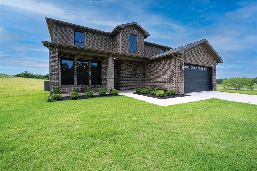 Welcome to **101 Crepe Myrtle**, a beautifully built **2024 new construction** home located in a quiet, **secluded lakefront community** on the shores of **Richard Chambers Lake**. Designed for those seeking **privacy, space, and elegance**, this luxury retreat offers the perfect escape from the everyday while keeping nature and modern comfort in perfect harmony.

Situated on a **1-acre lot**, this **3,973 sq ft** home features **5 spacious bedrooms**, **4 full baths**, and **1 half bath**, including an **extra ensuite bedroom** perfect for hosting guests or multi-generational living. Every corner of this home showcases quality craftsmanship and thoughtful design—from the **beautiful brick exterior** to the interior's **natural stone and granite countertops**, soaring ceilings, and abundant natural light.

The heart of the home is the gourmet kitchen, equipped with **top-of-the-line appliances**, custom cabinetry, and an open layout ideal for entertaining. Unwind in the **media room**, enjoy game nights in the **game room**, or relax in the expansive living areas that flow effortlessly into the outdoors. There's **plenty of room for a custom pool**, creating a true resort-style setting in your own backyard.

A spacious **2-car garage** adds convenience, while the tranquil setting offers **easy access to Richard Chambers Lake**, one of Texas’ best-kept secrets for lakefront living. Spend your days **boating, jet skiing, paddleboarding, kayaking**, or fishing in the calm, open waters. Whether you're seeking high-adrenaline lake adventures or peaceful moments watching the sunset from your porch, this property brings it all to your doorstep.

**101 Crepe Myrtle** is more than a home—it’s a private lakeside sanctuary where timeless design meets outdoor living. Experience the serenity, space, and sophistication you deserve, just a short drive from city amenities yet a world away in feel.