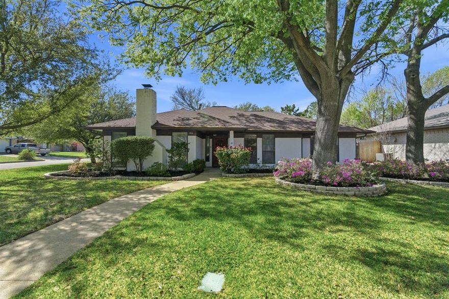 NEW roof, gutters, and leaf guards offer peace of mind from day one! Ideally situated on a desirable corner lot in an established South Arlington neighborhood, this meticulously maintained home showcases pride of ownership at every turn. From the moment you arrive, you’re welcomed by timeless charm, mature trees, lush landscaping, and an inviting curb appeal that instantly feels like home.

Inside, the spacious living room serves as the true heart of the home, highlighted by tall windows, abundant natural light, recessed lighting, and beautiful wood-look tile flooring. A cozy wood-burning fireplace anchors the space, creating the perfect setting for relaxing evenings or gathering with family and friends. The bar area and sunlit dining space flow effortlessly into the living area, offering an open, connected layout ideal for both everyday living and entertaining.

The kitchen is thoughtfully designed with granite countertops, double ovens, white cabinetry, and a new dishwasher—blending functionality with a clean, modern aesthetic. A versatile floor plan includes generously sized bedrooms along with a flexible bonus space that can easily function as a breakfast nook, home office, playroom, hobby room, or second living area—adapting to fit your lifestyle.

Step outside and unwind in the spacious backyard, perfect for entertaining, gardening, or simply enjoying the outdoors at the end of a long week. An oversized shed provides excellent additional storage, while the garage features a freshly painted floor and even more functional space.