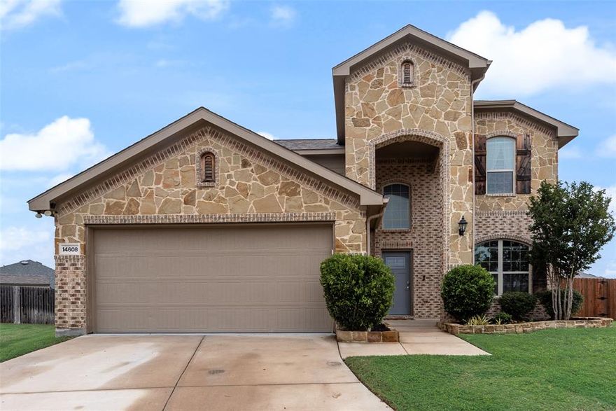 Step into a home that delivers standout outdoor living and a thoughtful, highly functional layout on a spacious culdesac lot. The backyard is designed to impress with a large covered patio featuring a tongue and groove gabled roof, ceiling fans, and an electric fireplace framed by stacked stone with TV mount. An outdoor kitchen with built in bar top, gas grill, and refrigerator makes entertaining effortless, while the sparkling pool with waterfall creates a true retreat. Pride of ownership is evident throughout, with careful upkeep and attention to detail at every turn. Inside, the open concept floor plan offers both comfort and versatility. The modern kitchen anchors the main living space with a large island, quartz countertops, stainless steel appliances, gas range, walk in pantry, and subway tile backsplash, all overlooking the living room. The living area is highlighted by a stacked stone electric fireplace with built in shelving and accent lighting. Durable wood look tile runs throughout the main living areas, kitchen, and office for both style and easy maintenance. The primary suite is conveniently located downstairs and features a decorative accent wall, ensuite bath, and walk in closet. A front office with French doors and built in cabinetry, along with a powder bath, adds flexibility to the main level. Upstairs includes three additional bedrooms, a full bath, and an oversized game room. Additional upgrades include added storage decking above the garage, epoxy garage flooring, insulated garage door, recently updated HVAC components, and a newer roof. Located within Northwest ISD, this move in ready home combines quality updates, a desirable layout, and exceptional outdoor space that is ready to be enjoyed!
