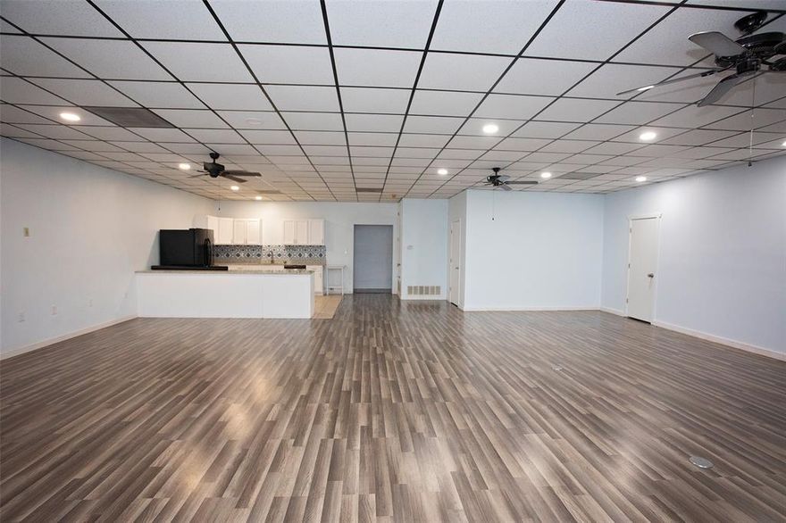 This exceptional commercial property sits on a 1-acre corner lot, offering a total of 4,400 square feet of commercial space with a fully equipped kitchen. Part of that square footage is being used as an AIRBNB that offers 3 bedrooms and 3.5 baths, including a large ADA-compliant primary suite. Washer and dryer space. The space features new plumbing, an open parking lot, and is fully fenced for security. Outside, you will find a 20x20 storage building on a slab, two carports, and covered RV parking, offering ample space for business needs. Lots of space to make it what fits your business dreams. With its versatile layout, modern updates, and prime location, this property is a rare find. Schedule a showing today and explore the endless possibilities!