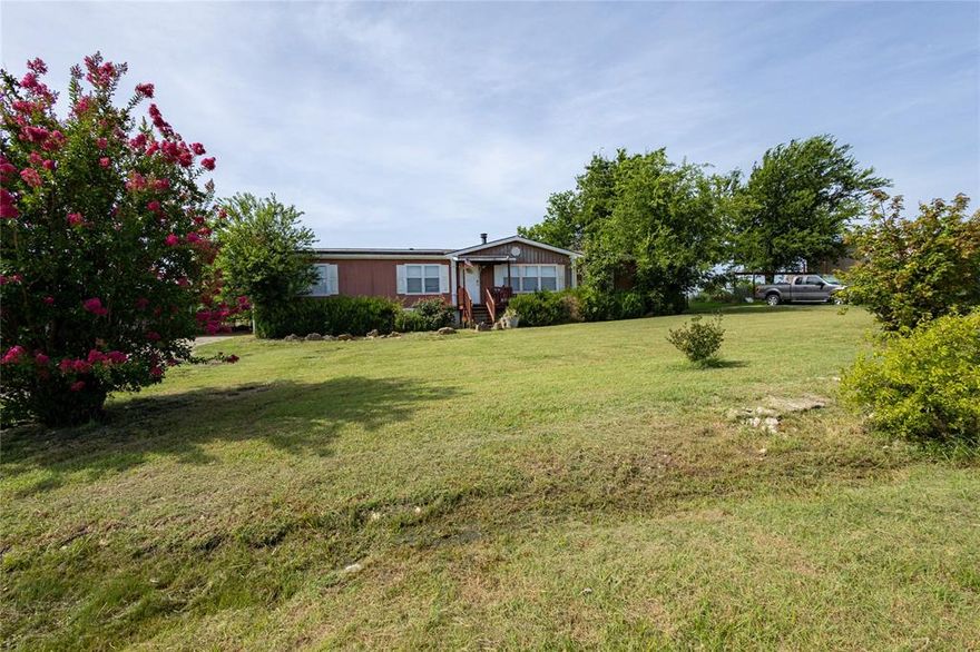Well-maintained double-wide home on one acre in Godley featuring 3 bedrooms and 2 bathrooms. This spacious property offers solar panels for energy efficiency, two separate driveways, a two-car covered parking area, an RV and welder outlet, and an above-ground pool perfect for relaxing or entertaining. The layout is functional and comfortable, with plenty of outdoor space for storage, gatherings, or simply enjoying quiet country living. Conveniently located with easy access to schools, local amenities, and major roads, this property is a rare find with valuable features and room to grow.