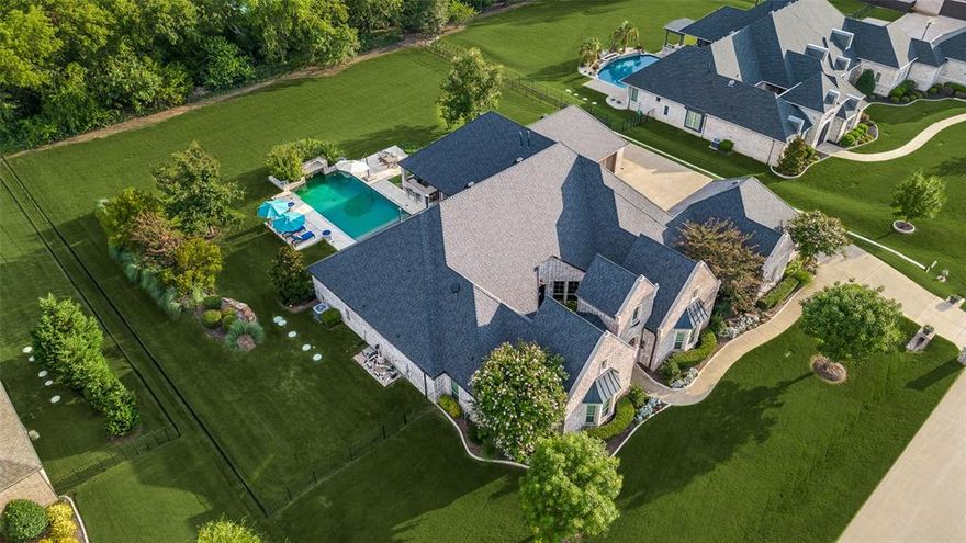 Welcome to Christie Farms! This extraordinary single-story pool home offers luxury, privacy, and an unbeatable Prosper location within a gated community. Enter through a private courtyard that creates a warm welcome for guests and leads to the Casita-style living quarters—perfect for visitors, or in-laws. The home is gracefully situated on an expansive, beautifully landscaped 1-acre lot, offering an impressive 5,200 square feet of refined living space. The flowing floor plan is thoughtfully designed for both grand entertaining and everyday comfort, with 5 generously sized bedrooms—each featuring its own ensuite bathroom for ultimate privacy. The primary suite stands out with oversized bay windows, while the spa-like en-suite bath features a soaking tub, separate shower, dual closets & dual vanities. The heart of the home is the gourmet kitchen, fitted with top-of-the-line Wolf appliances, custom cabinetry with glass doors, striking granite countertops, & a massive walk-in pantry! The expansive island opens to an inviting family room bathed in natural light. Adjacent to the main living area, you’ll find a combination game room & media room, tucked away for privacy—an ideal setting for entertaining family and friends. A dedicated wine, beverage, icemaker, & wet bar area further enhances the home's hosting capabilities. Additional amenities include hardwood floors throughout, a well-appointed office with a spacious storage closet, and a cabana bath for poolside convenience. Step outside to enjoy the expansive covered patio & outdoor kitchen, which overlook an immense backyard oasis with a sparkling pool—perfect for creating your own private resort ambiance. The property offers ample parking with two spacious garages (28x25 and 25x25). Located in the highly sought-after Prosper ISD, with proximity to Cockrell Elementary, Rogers MS, & Walnut Grove HS. Don’t miss the opportunity to make this remarkable residence your own, in one of Prosper’s most prestigious communities.