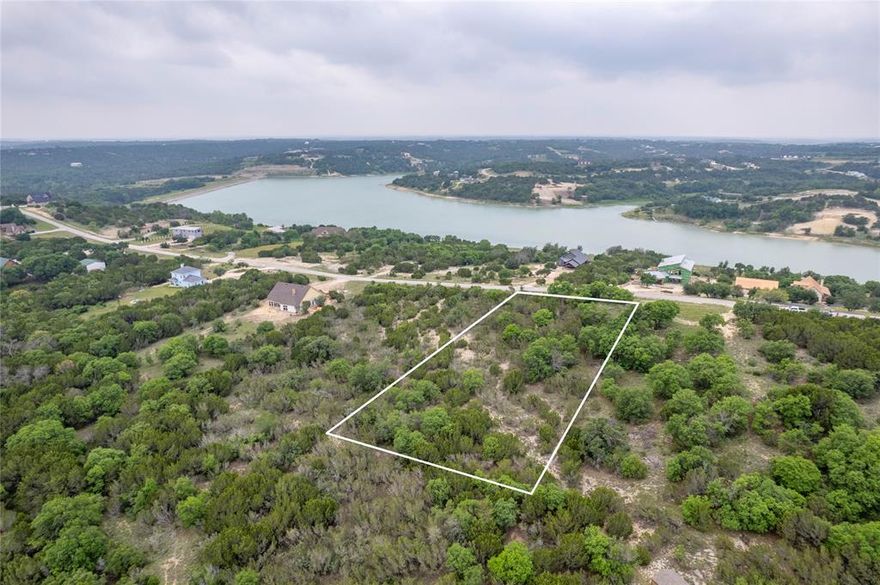 Great location, great lot. Enjoy the wonderful hilltop view spanning across the approx 100 acre recreational lake.  Build your forever home on this lot and enjoy the lake view on one side and the beautiful hill country view from the other side. Two easy ways to gain access to entry into this development.  Mountain Lakes provides a first lass fishing lake, recreational lake, clubhouse, community pool, play park and exercise park,  RV area, walking trail, garden co-op, and more.  Convenient to DFW, Granbury, Glen Rose, Weatherford, and Stephenville.  Bluff Dale, Texas, bring the family and your friends a relaxing atmosphere you will love.