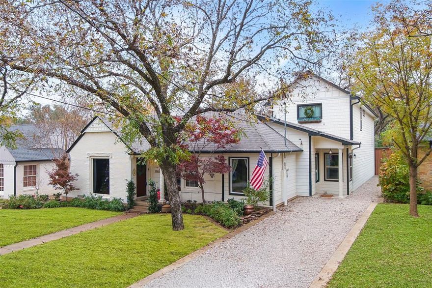 This beautifully renovated 1940 West Kessler home honors its architectural heritage while embracing contemporary sophistication with over 3,100 square feet of designer-curated space, where every detail was chosen with intention. Positioned on one of Oak Cliff’s coveted, quiet, one-way streets, up from the 3rd hole on Stevens Park Golf Course and under 1.5 miles to Bishop Arts District. The main level features a primary sanctuary with spa-inspired ensuite, including a soaking tub within a walk-in shower, custom closet, private patio access, and elegant herringbone floors. At the heart of the home, an entertainer’s hub showcases a wraparound wet bar with dual wine refrigerators connecting three distinct living areas. The kitchen offers professional stainless appliances, leathered granite countertops, a prep island, a sizeable walk-in pantry, and screen porch access. The formal dining room preserves original arched doorways and sits adjacent to both the custom bar and chef’s kitchen. A converted side porch with generous built-in storage serves as a dual home office, while an additional first-floor ensuite bedroom provides flexibility for guest or multi-generational living. Upstairs, a split-bedroom layout centers around a spacious family room. Two bedrooms with custom closets share a designer full bath with double vanities with a stunning tiled shower. A 100 sq ft bonus space with dormer windows offers the perfect reading nook, meditation room, or whimsical children’s hideaway. Outdoor living includes a screened entertainment patio flowing to an elevated dining deck and a custom soaking pool with full filtration and composite decking. Mature landscaping creates beautiful, functional zones for dining, lounging and play. A substantial 2021 addition seamlessly blends old and new. Designer details include curated wallpaper and crown molding throughout. Major system updates include HVAC, roof, and plumbing. An oversized laundry room with utility sink adds convenience.