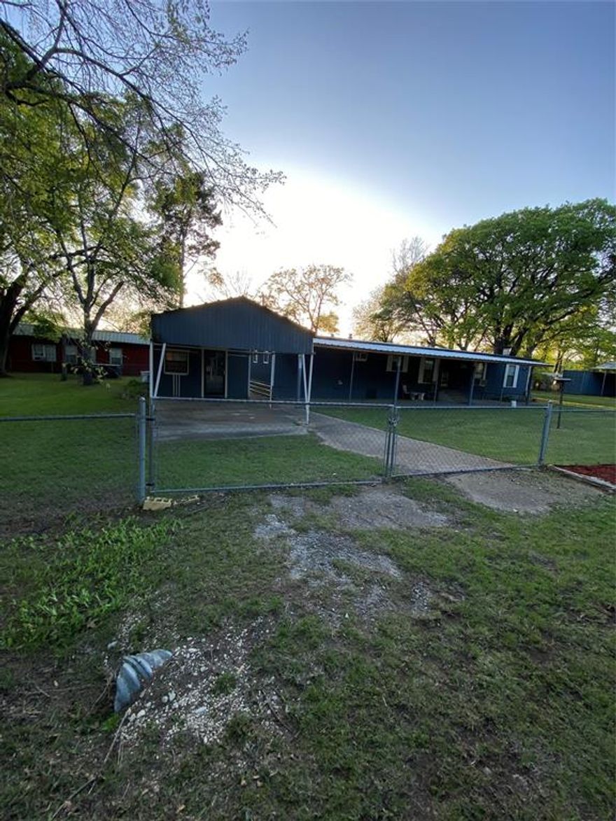 $5000 seller concession to be used with buyers choice of either closing costs or price reduction. Calling all fisherman!!  Bring your boat and lake toys.  Spacious, open, and inviting. Tree-shaded lots. This is a lake house with a fireplace on 6 lots with an additional 1 bedroom, 1 full bathroom bunkhouse & covered front porch, two driveways and storage buildings. Hot tub, shipping container & additional awning convey. Approximately 5 minutes to Cedar Mills Marina and Resort at Lake Texoma.  Updated sub flooring & carpet, added shelving to kitchen. Sellers completely tore down front porch area to improve the front of the home.  Buyer to verify all information. Thank you for visiting; we look forward to working with you.