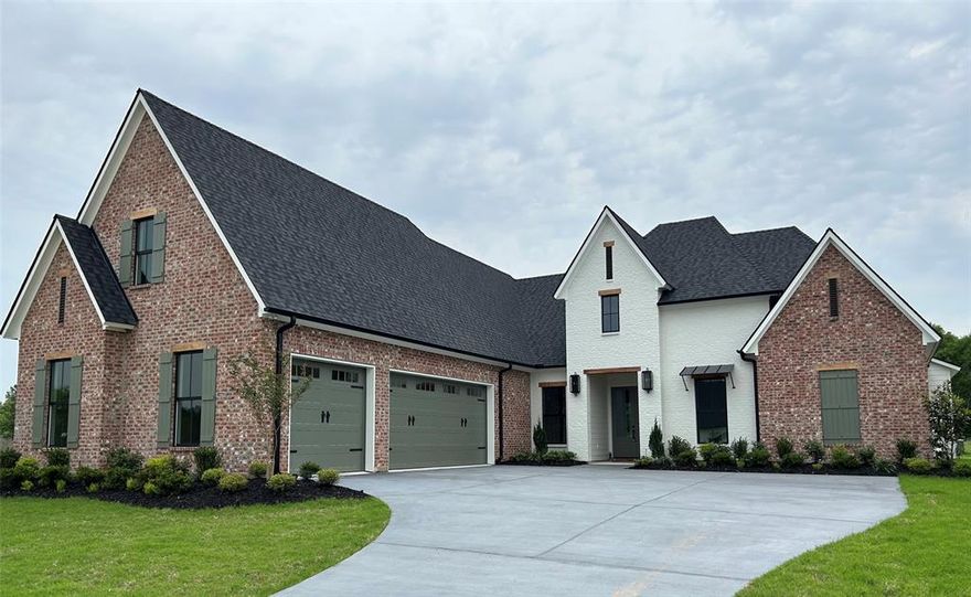 Gracious living awaits in this gated South Shreveport community.

Step inside to a light-filled, open-concept design where a striking fireplace with custom built-ins anchors the living area, seamlessly flowing into the dining space and a chef-inspired kitchen. A sophisticated blend of white oak stained and painted cabinetry is paired with quartz countertops, an integrated quartz sink, and a statement champagne bronze faucet with quartz and wood accents. A full quartz backsplash with discreet under-cabinet outlets, layered lighting above and below, a 6-burner GE Café range, wall oven, microwave, and a spacious pantry with a deep quartz shelf—perfect for a coffee bar—make this kitchen ideal for everyday living and entertaining.

Expansive windows in the great room overlook the backyard and a 29-foot covered patio featuring a painted brick fireplace, griddle, 2-burner cooktop, undercounter refrigerator, and sink—designed for effortless outdoor living. Opposite the main living area, a versatile office, music room, or playroom with French doors and a front-facing window offers flexibility and privacy.

The main suite features large windows, an oversized walk-in closet with built-ins and pull-down hanging space, and a luxurious bath with dual vanities, soaking tub, tiled shower, and private water closet. Two additional main-level bedrooms share a bath with separate vanity areas.

A generously sized utility room includes a sink, cabinetry, and ample workspace. In the hallway is a beautifully finished powder room. A spacious upstairs bonus room or bedroom with walk-in closet and private bath provides the perfect retreat for guests or teens.

Additional features include app-controlled garage access and connection for a water filtration system.