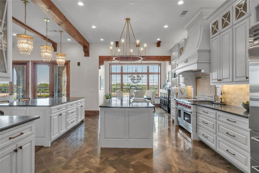 Experience Elevated Luxury on the TPC Craig Ranch Golf Course. Nestled within an exclusive gated enclave of only 23 residences, this extraordinary end unit redefines lock-and-leave luxury living with uninterrupted panoramic views of the prestigious TPC Craig Ranch Golf Course. A true masterpiece of design and craftsmanship, every detail has been meticulously curated. You are welcomed by rich 5-inch mesquite plank hardwood floors and a dramatic floating staircase adorned with custom-forged iron balusters that is an architectural statement. The gourmet kitchen is a culinary work of art, outfitted with Wolf and Sub-Zero appliances, a hand-forged Rocky Mountain bronze sink, natural stone and marble flooring, and dual islands—one featuring an awe-inspiring Labradorite slab countertop that shimmers with iridescent depth. RH lighting adds a sculptural glow, elevating the space to gallery-like elegance. The great room is warm and inviting with alder ceiling beams and flows seamlessly to a covered outdoor living area, complete with built-in grill and fireplace—perfect for entertaining or quiet sunset evenings. The convenience of a private elevator takes you to the primary suite, a true sanctuary featuring a fireplace, beverage center, and an expansive balcony with breathtaking views. The spa-inspired ensuite bath stuns with a Terrazzo stone freestanding tub, a walk-in shower adorned in mother-of-pearl, and custom dual vanities—his in luminous onyx and hers in radiant turquoise. A boutique-style walk-in closet with Rocky Mountain hardware, Emtek crystal doorknobs, and a moveable center island topped in timeless Carrera marble. Each guest suite offers privacy and comfort with spa-quality ensuite baths and walk-in closets. This is more than a residence—it's a statement of style and refinement in one of the most coveted golf course communities in Texas. Charter Membership to TPC Craig Ranch is included ($80K value) as well as a VIP package to the PGA Tour’s CJ Cup Byron Nelson.