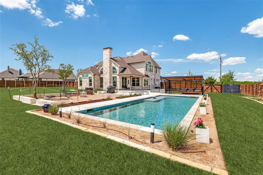SELLERS RELOCATING need to sell BEAUTIFUL CUSTOM HOME WITH POOL, CABANA AND ACREAGE-NO HOA. 
Welcome to this stunning custom home situated on 1.072 acres. This upgrade 4 sided brick and stone property offers privacy, space and exceptional features inside and out. The fully fenced property includes a sprinkler system and is designed for entertaining, featuring a custom pool with heater and chiller, a cabana, and a courtyard with room for a fire pit and guest seating. Excellent space out back for building your own shop. Inside you will find a gourmet kitchen equipped with Wolf appliances, a butler's pantry, custom built-in cabinets, decorative tile, quartz countertops with a spacious eat in area. The large family room showcases a floor to ceiling tiled fireplace, abundant natural light and a ceiling fan. The versatile formal dining room can also serve as a home office. The spacious primary suite features vaulted ceilings and luxurious ensuite bath with dual vanities, jetted tub and separate shower and walk-in closet. A functional utility room with room for freezer will host full WD as well. Upstairs features large bedrooms Check out Walk-in attic for storage and a perfect game room. This home has it all. Perfect for entertaining and living inside and out.