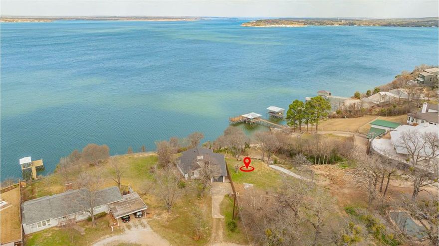 'CRYSTAL BLUE PERSUASION' will overtake you as you step on this land, which produces the greatest view of the lake. Enjoy watching the birds and possibly an occasional eagle 'LEARNING TO FLY'. Your head will 'TURN, TURN, TURN' as you drink in all the activity on the water below you, including a full view of the famous Fort Worth Boat Club and all its 'SAILING' races. The 'BLUE SKY' and 'NORTHERN SKY' will guarantee you be 'FEELIN ALRIGHT' as you 'LISTEN TO THE MUSIC' at this 'EAGLE rocky MOUNTAIN HIGH' perspective. FYI -John Denver wrote some of his first songs around the corner on the water as he went to a local high school. The lot can't be seen from the main road, so don't become in a 'CAN'T FIND MY WAY HOME' status! There is room for a 'SECRET GARDEN', 'FOR WHAT IT'S WORTH', and when the moon is out, plenty of space for a 'MOONDANCE'. As you gaze 'INTO THE MYSTIC', there will be 'CONVERSATION' about 'AIN'T WASTING TIME NO MORE' for a 'PEACEFUL EASY FEELING' (the EAGLES spent several weeks on this lake many years ago) while you become 'COMFORTABLY NUMB'. So enjoy and 'DON'T STOP BELIEVING' this could be yours!! Dare I say 'The sun pours in like butterscotch and sticks to all your senses' -JM.
This property is 750,000 and includes 2 separate lots (totaling almost 0.6 acres). The brand new remodeled home is over 1,550 square feet with 2 beds and 2 baths. 1,500,000 for the house and 750,000 for the vacant lot (what a view it has). Can be bought together or separately. Do not access the property without consent from the Seller.