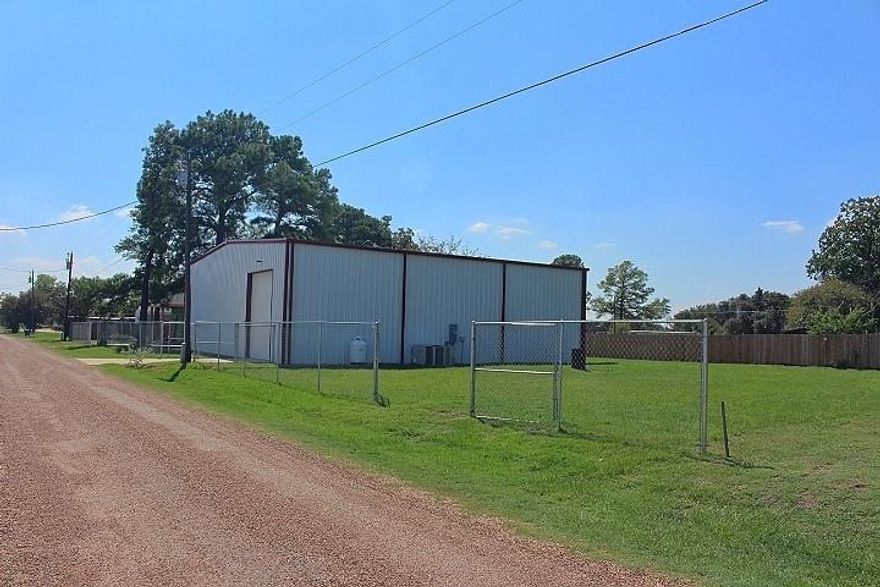 Unique Residential with Commercial Applications. This property is located across the street from Gun Barrel City Airport. It is a foam-insulated 60X60X17 tall (3600sqft) metal building with a 20X40 (800sqft) 1-1 apartment inside. The apartment has a 2nd story framed in with plumbing added, which could be 2 bedrooms, a bath, and a living area or what your imagination dreams. There will be some materials left to help complete your dream. The concrete floor has extra depth and rebar. Two HVAC units, one for the shop area and the other for the apartment, heat and cool efficiently. There are overhead doors at the front and back of the building. The 2 lots are partially fenced providing room for growth.
