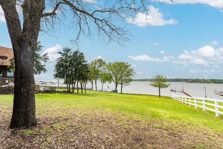 BIG OPEN WATER VIEWS with your very own beach-style walk in! This beautifully maintained, move-in ready 3-2 home with 2-car carport sits on nearly half an acre with 69 feet of lake frontage. It offers a long concrete driveway, covered parking, and plenty of space for lake life fun. Enjoy panoramic water views from your backyard and easy walk-in access to the lake, perfect for swimming, kayaking, paddle boarding, or launching your favorite water toys. The home comes partially furnished with TVs, appliances, refrigerator with icemaker, plus washer and dryer. A nice storage building or workshop with electricity gives you room for tools, hobbies, or lake gear. Conveniently located near Gun Barrel City and Mabank shopping, restaurants, farmers markets, and medical facilities. Quick highway access makes it just 30 minutes to Canton, Kaufman, or Athens, and about an hour to Dallas or Tyler. Full-time or part-time, this is affordable open water living. Come claim your piece of Cedar Creek Lake!