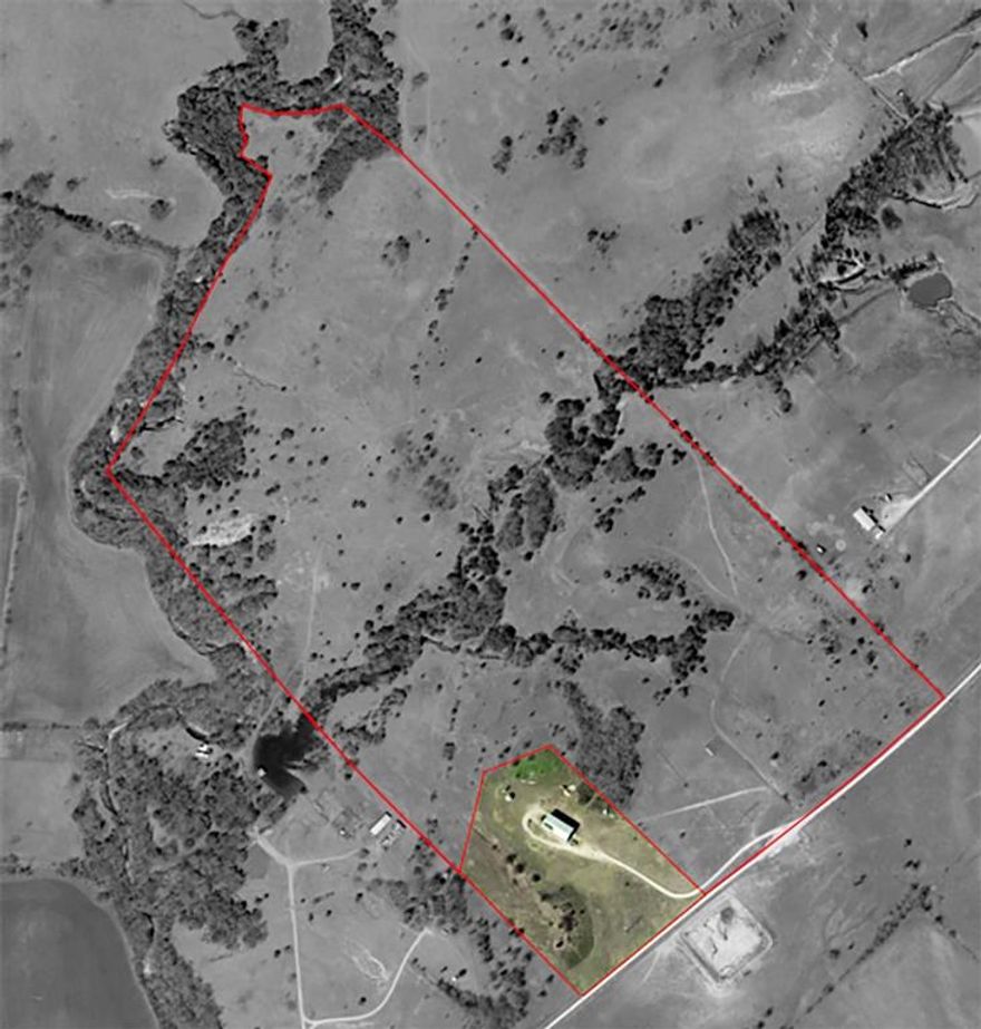 A rare opportunity to own 104.206 acres of versatile land in highly sought-after Wise County. Ideally located near HWY 51 and just minutes from Fossil Pointe Sporting Grounds and Eagle Canyon Raceway, this property offers a perfect blend of accessibility, rural charm, and recreational appeal. The expansive acreage is well-suited for livestock, hay production, or future development—making it ideal for ranchers, investors, or anyone seeking a strategic land acquisition with long-term potential. Included on the property is a 5,000 sq ft barndominium, featuring 2,500 sq ft of beautifully finished living space with 3 bedrooms and 3 full baths. Perfect as guest quarters, ranch manager housing, or a comfortable residence while building your dream home. Loaded with upgrades throughout, the barndominium adds tremendous value to the overall offering. Enjoy the natural beauty of the treed areas and take a peaceful walk down to the creek. Just under an hour from DFW and only 30 minutes to Denton and major hospitals, this property delivers both convenience and tranquility. With its prime location, wide-open space, and endless potential, this is an exceptional opportunity to invest in the future of Wise County.
